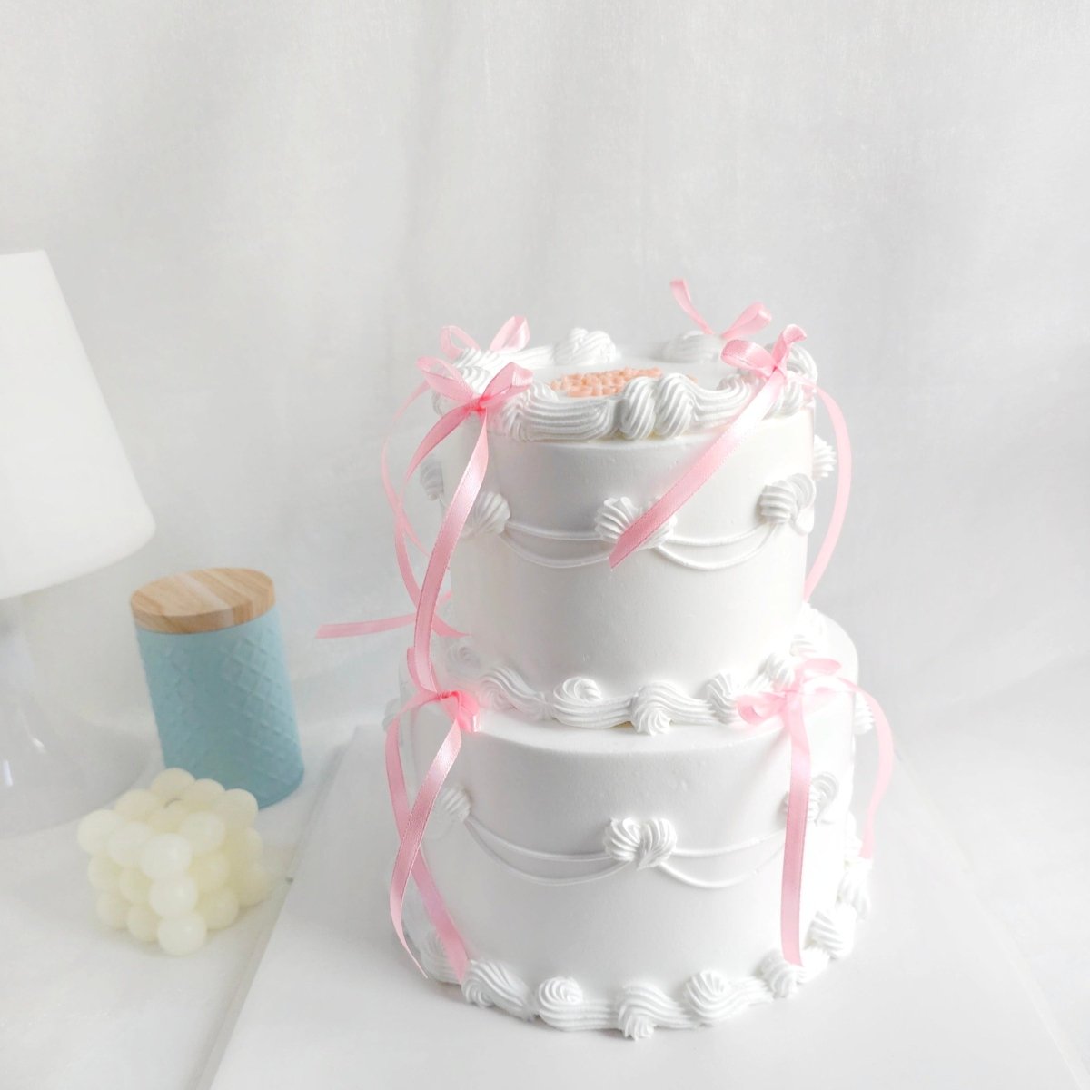 Wedding cake with pink ribbon | Honestweddingadvice.com